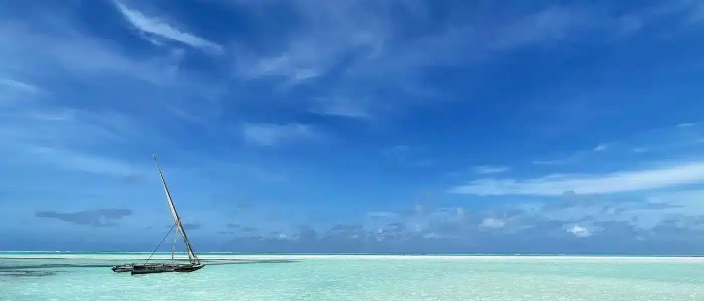 Narrow sandbank emerging from shallow water off Zanzibar