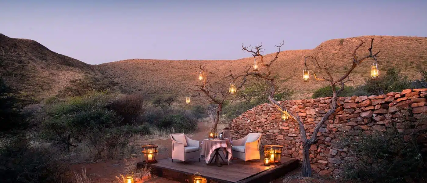 Couple at a private table as the dunes change color at sunset