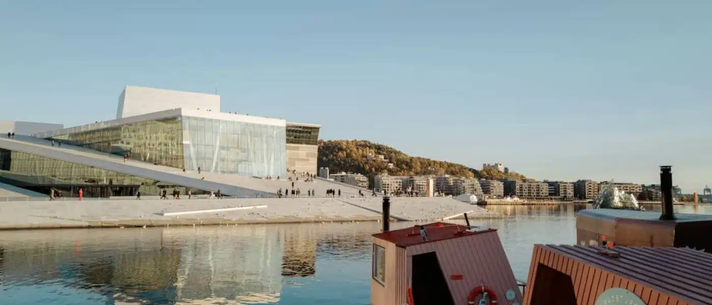 Floating saunas moored on a pier in Oslo's harbor