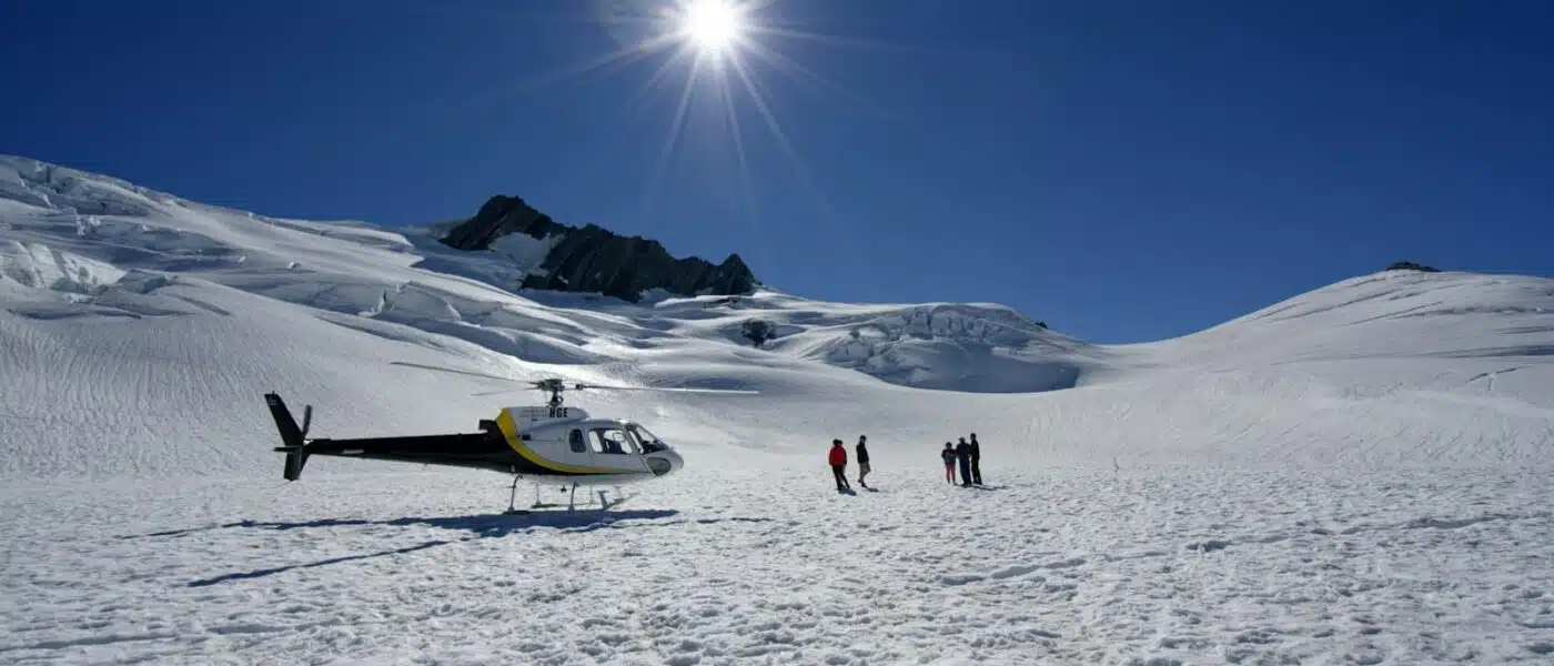 Hikers pausing to take in the vast ice of Franz Josef Glacier