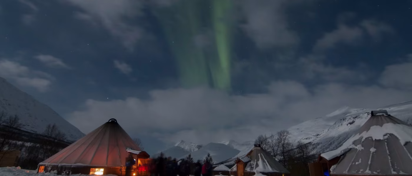 Traditional Sámi handicrafts and clothing displayed in a camp