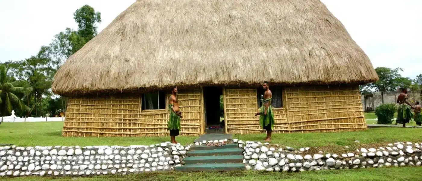 Fijian village meeting house by the coast