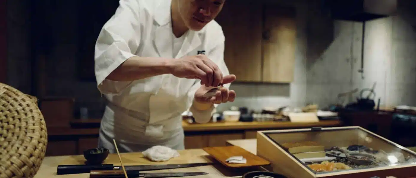 Omakase sequence of nigiri laid out on a sushi counter