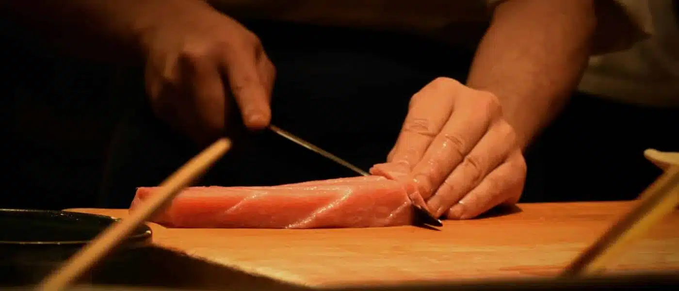 Trays of fish and seasoned rice ready at a private sushi studio