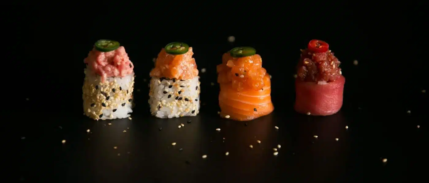 Guest shaping nigiri under the chef's supervision