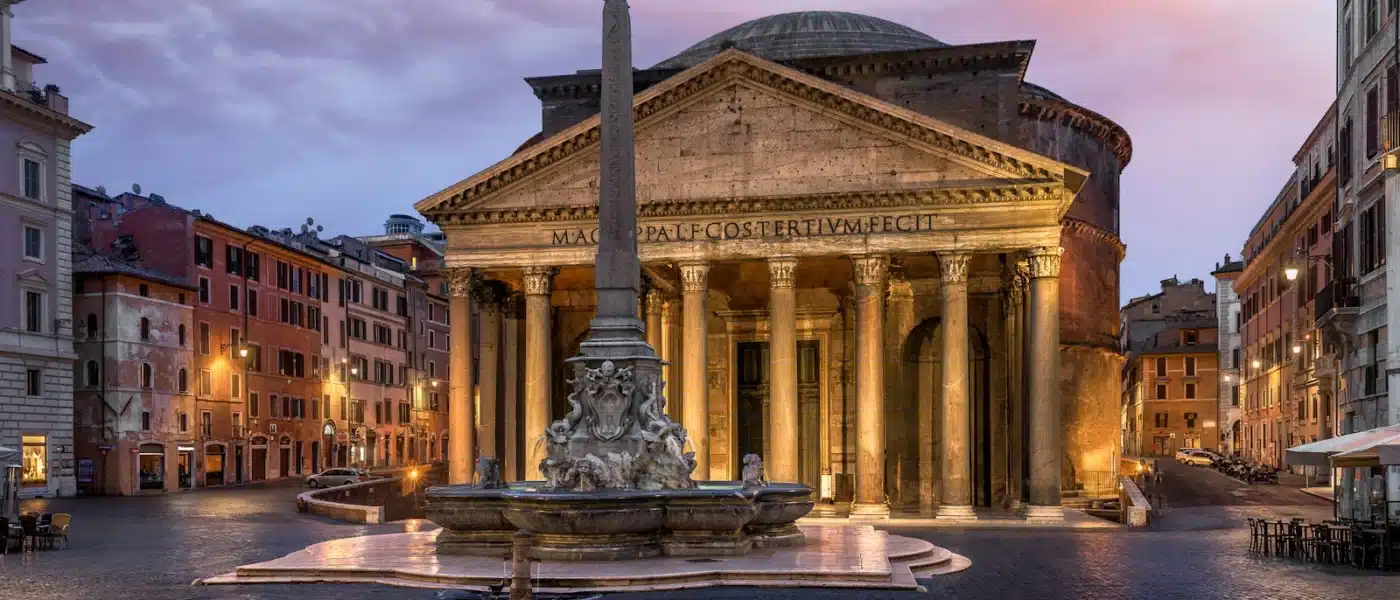 a large building with a fountain in front of it