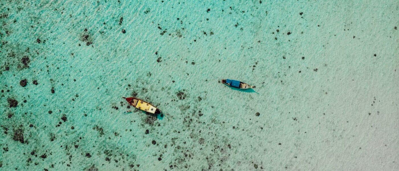 Manta ray gliding over a coral cleaning station in Bora Bora's lagoon