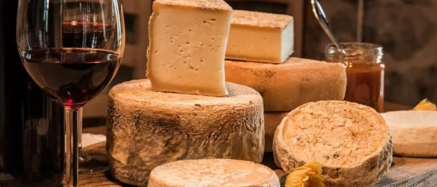 Shelves of blue and sheep's milk cheeses in the aging room