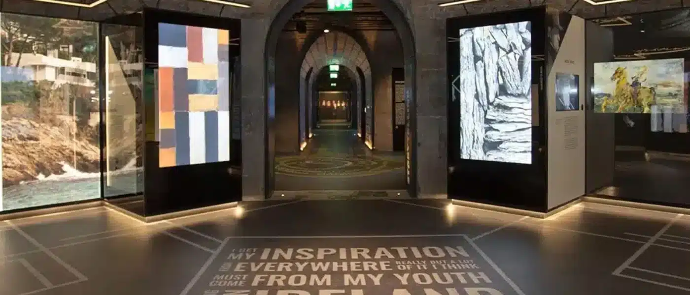 Green EPIC passport being stamped at a museum gallery