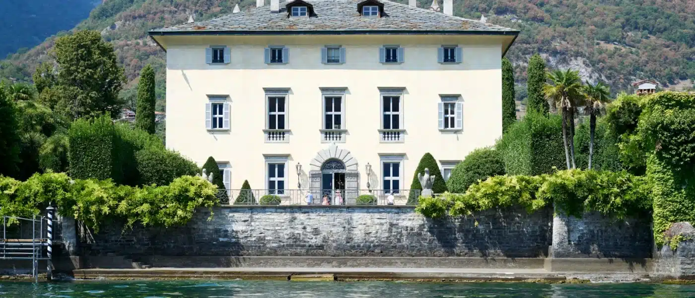 a house on a hill by a body of water Villa Lysis amalfi coast