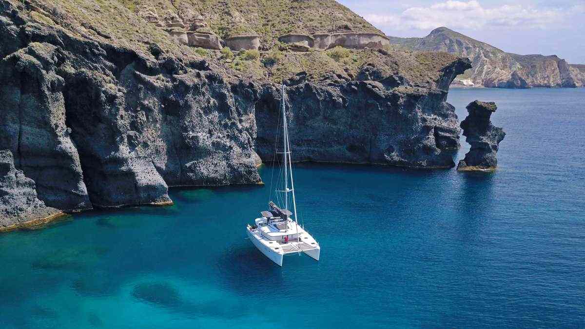 Sailing Santorini's Caldera at Golden Hour on a Private Charter