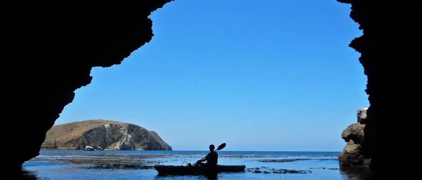 Sea arch with daylight shining through on the Scottish coast
