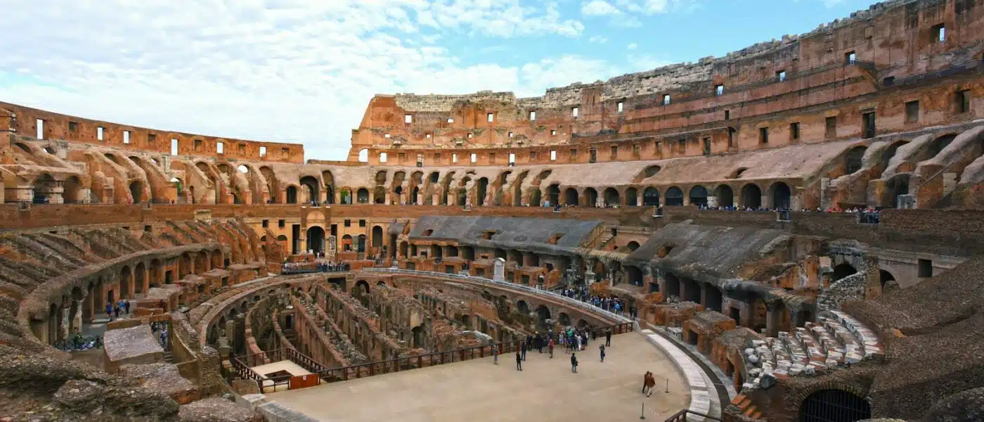 Numbered entrance arch carved into the Colosseum's stone