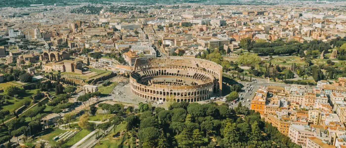 Family looking out over the Colosseum arena with their guide