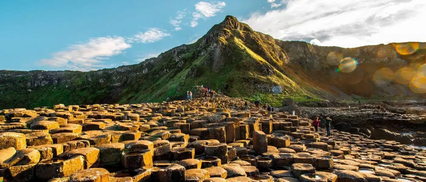 Waves breaking over interlocking basalt columns on the Antrim coast