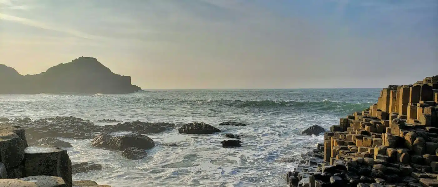 Rock pool with seaweed among the basalt columns