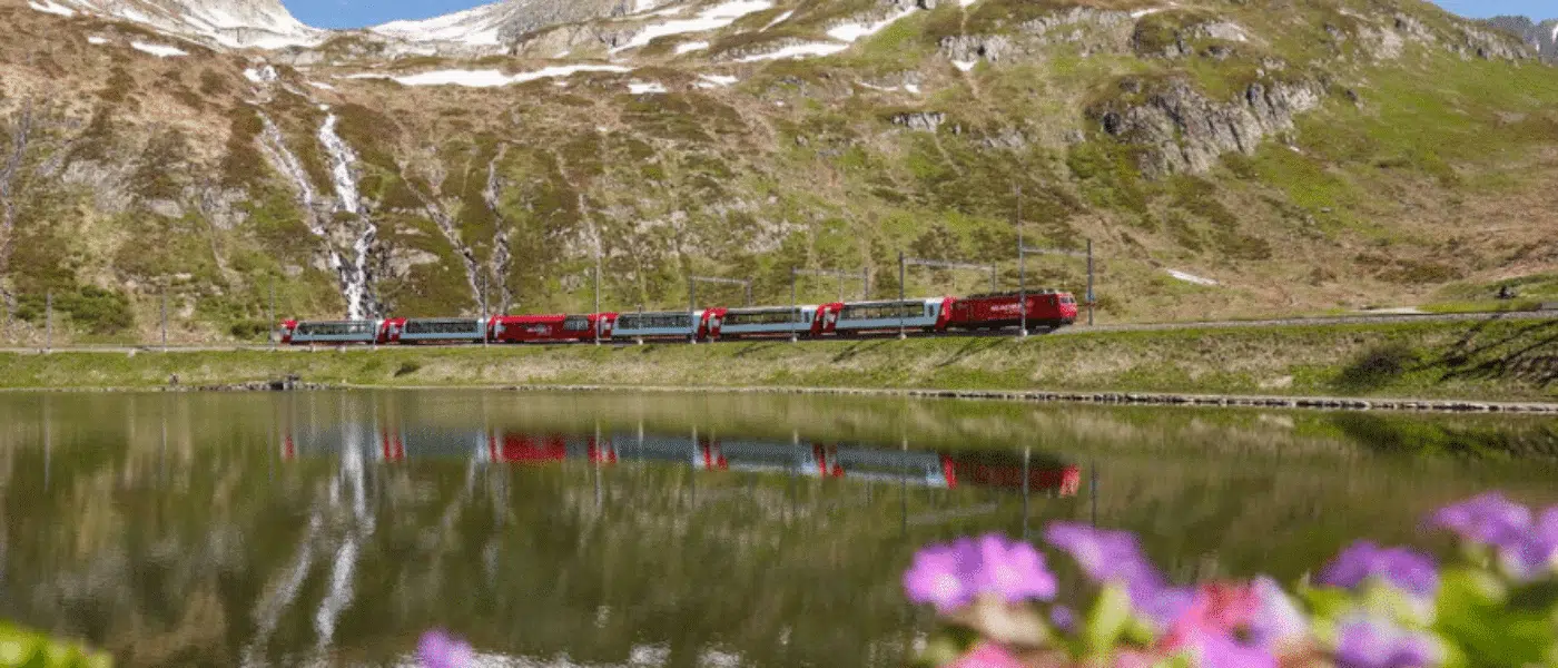 Linen-set table and panoramic windows in a Glacier Express carriage