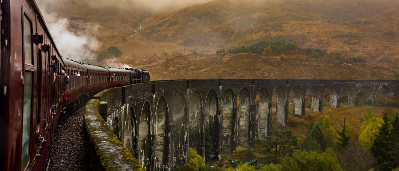 Glenfinnan Viaduct's concrete arches curving across the glen