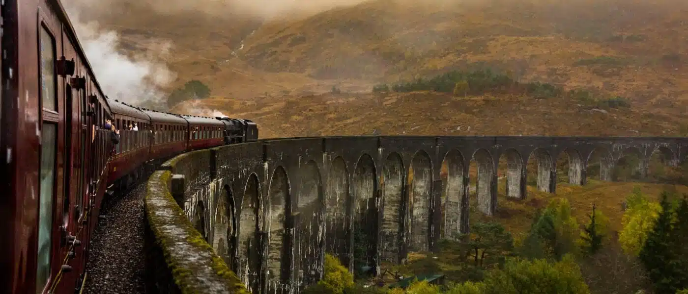 Glenfinnan Viaduct's concrete arches curving across the glen