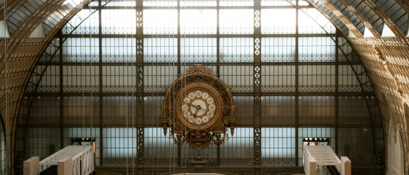 Main hall of the Musée d'Orsay with sculpture and glass roof