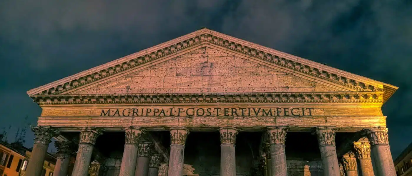 The Pantheon's dome lit softly by candlelight at night