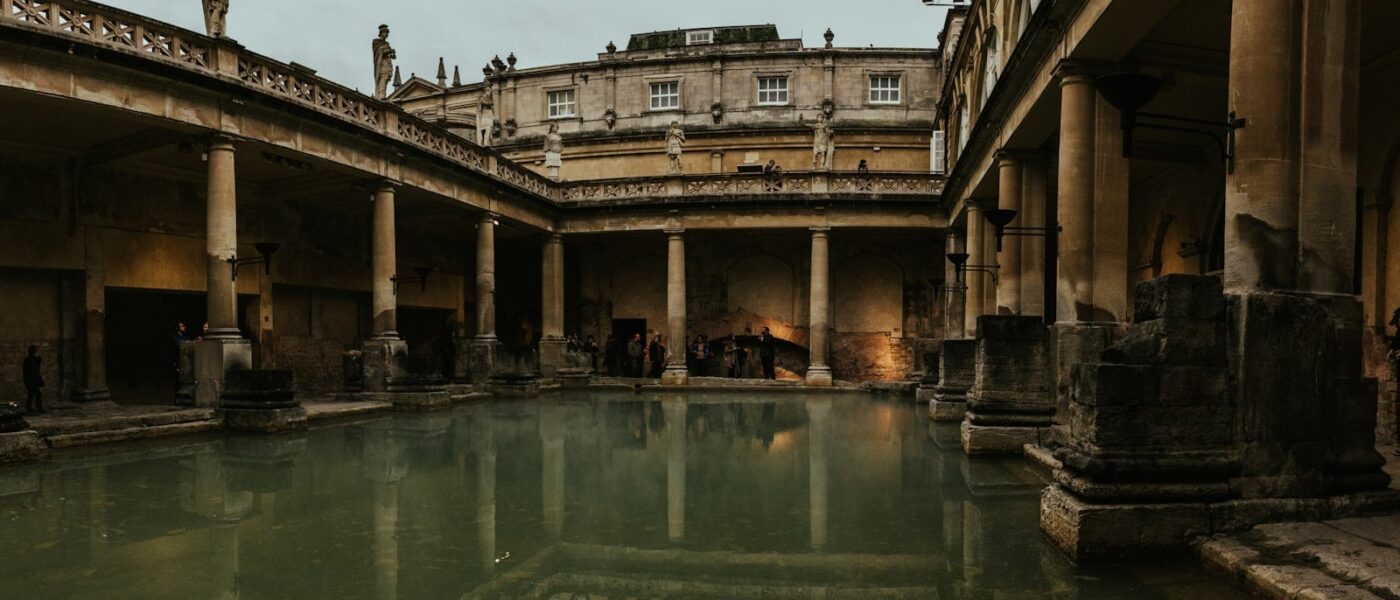 Roman paving and columns around the Great Bath in Bath